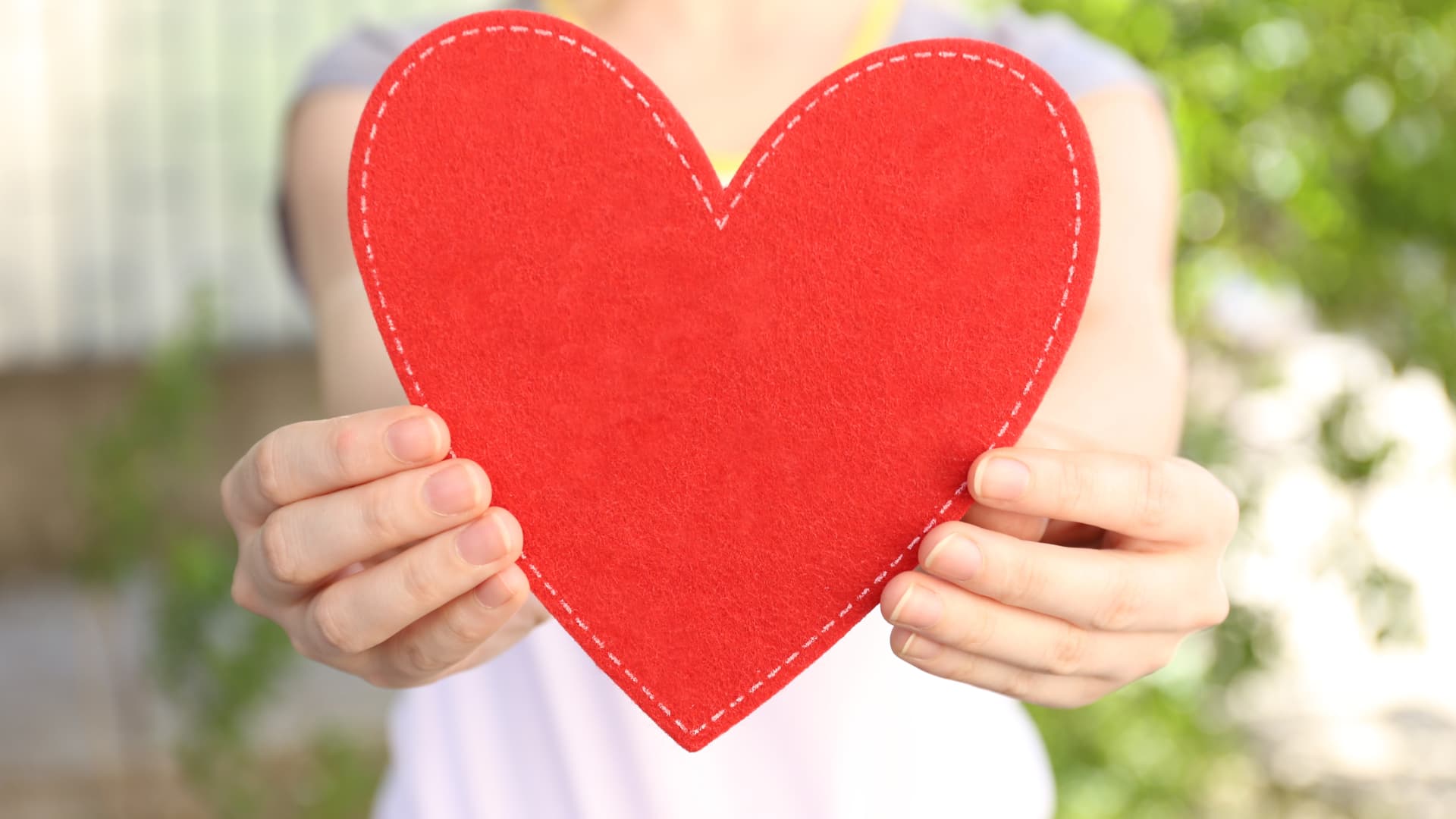 Woman holding felt heart
