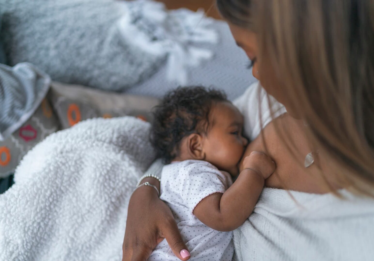 woman breastfeeding baby