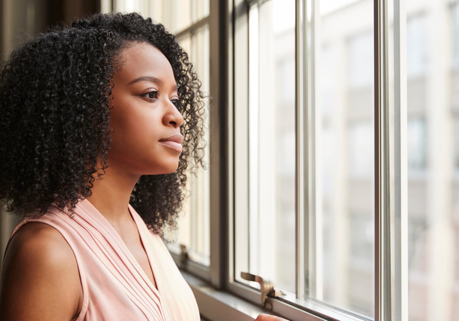 Woman looking out window
