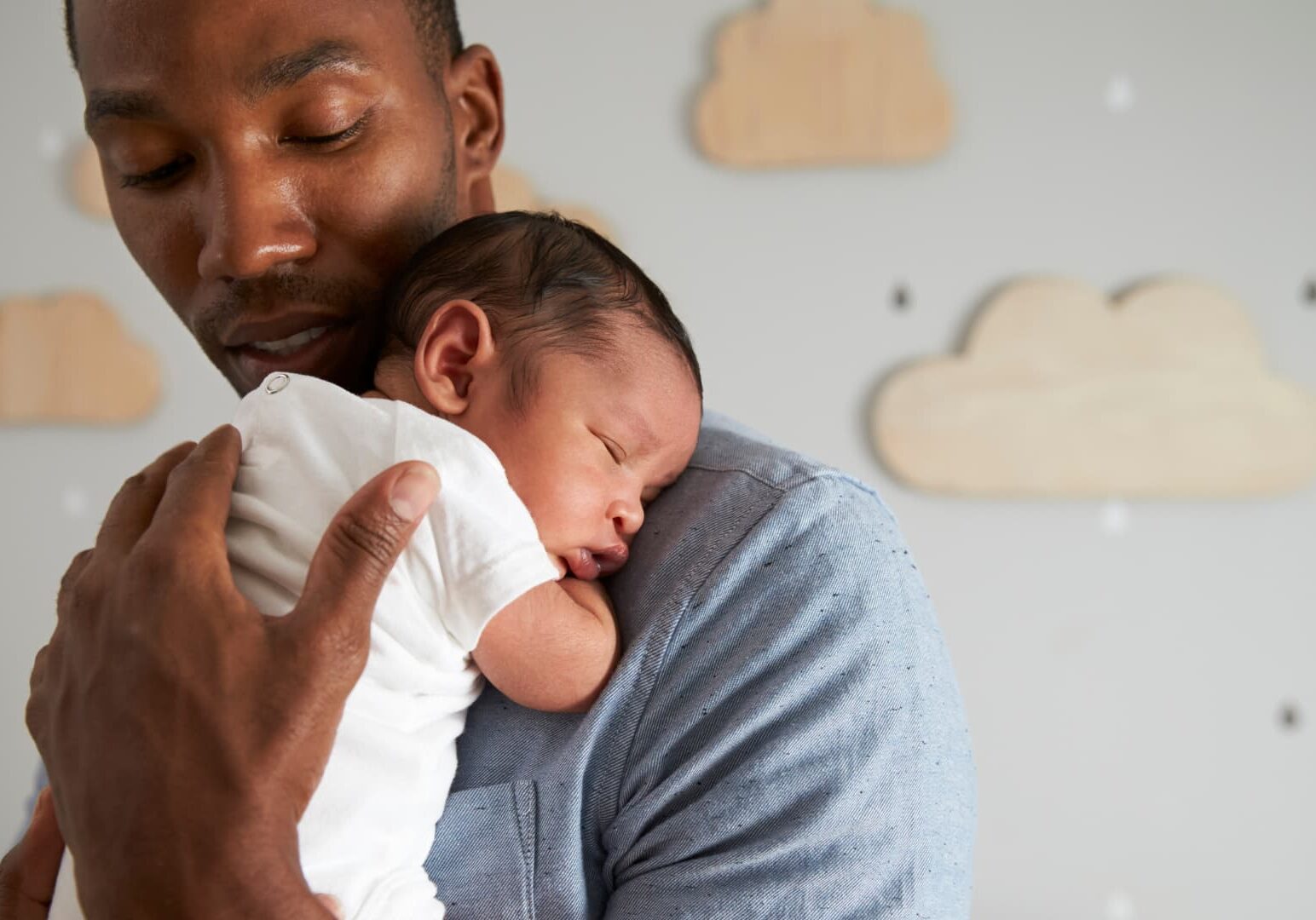 Young father holding baby